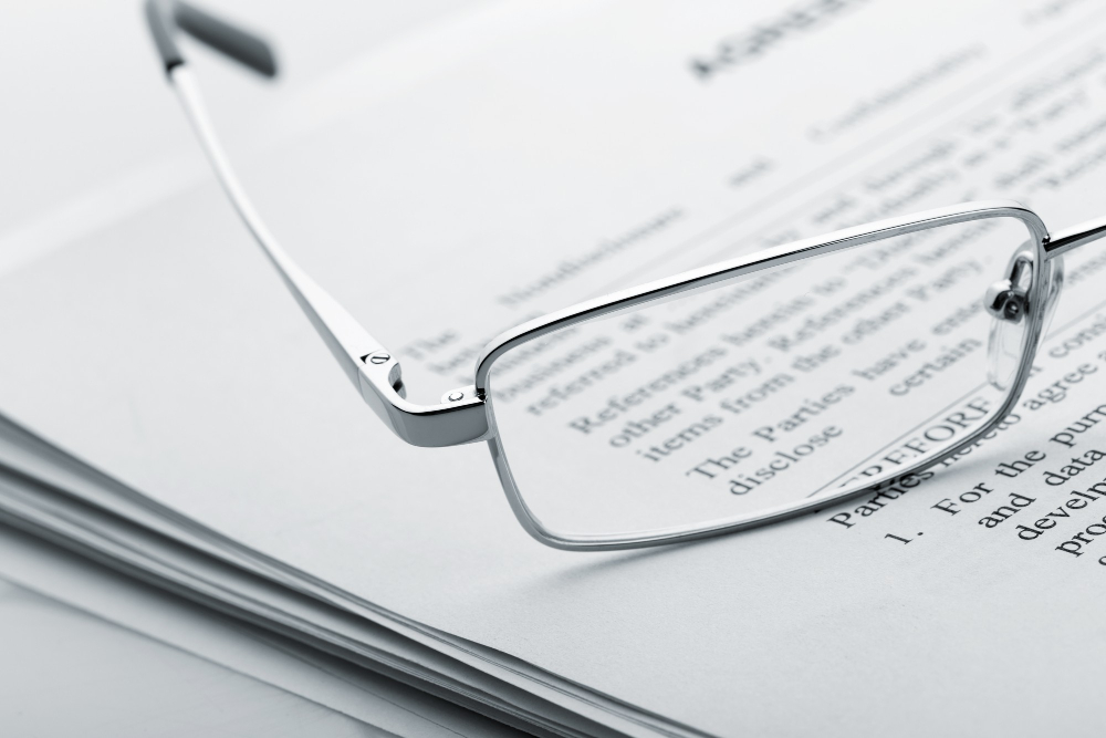 Glasses on a document close-up